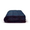The original puffy 2 person blanket by Rumpl is made from 100% recycled materials. Shown here folded, in deepwater blue with red edging.