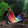 Camping with the recycled, waterproof Rainbow Everywhere Mat ground cover