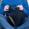 Putting jacket into sustainable stuffable travel pillow