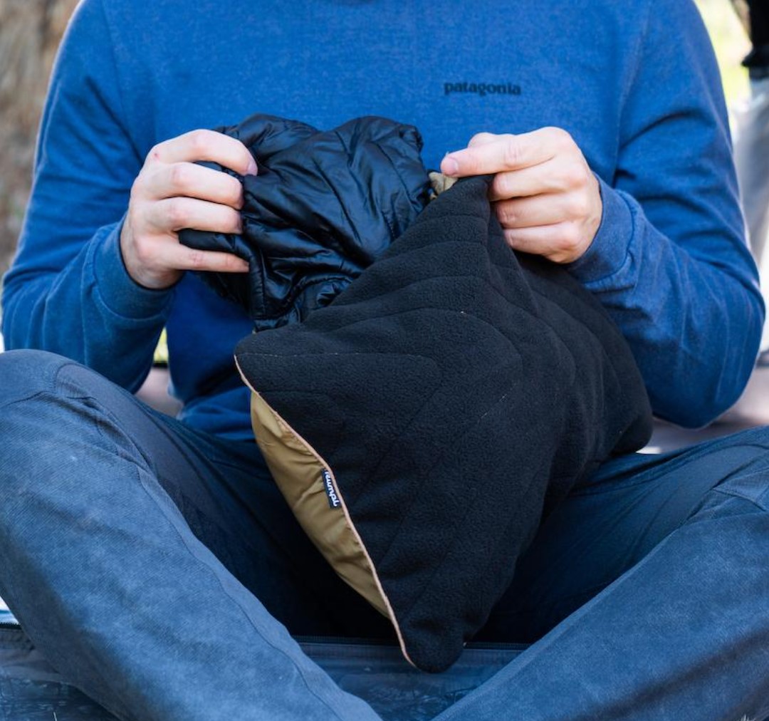 RUMPL-STUFFABLE-PILLOWCASE-2 Putting jacket into sustainable stuffable travel pillow