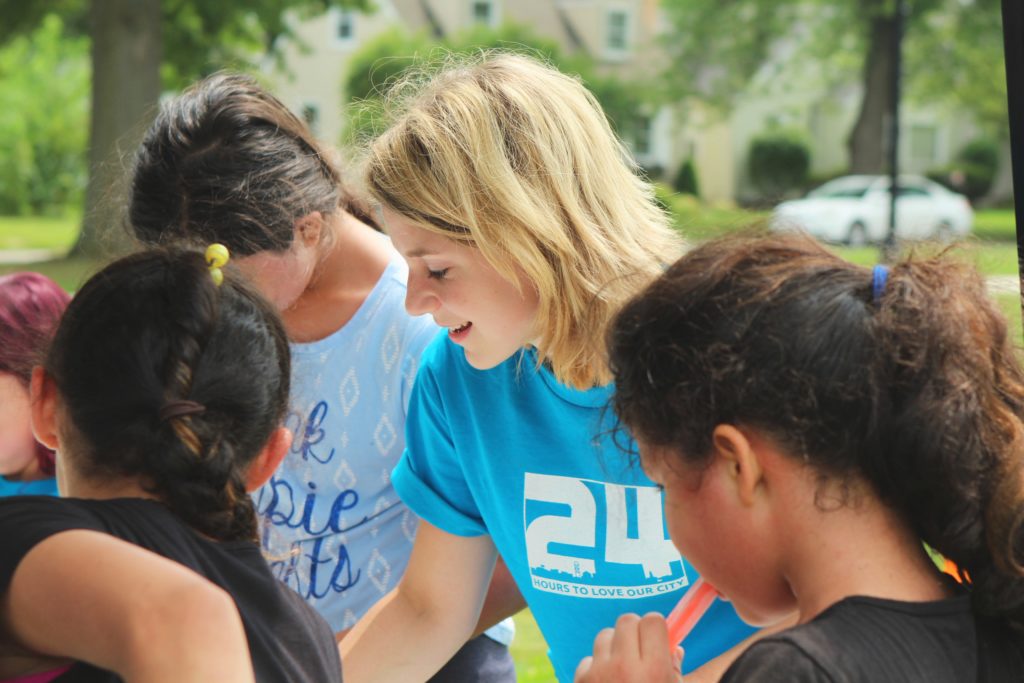 Woman volunteering with youth