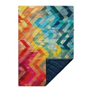 Close-up of the Rumpl Original Puffy Blanket in Geo; made from recycled materials and comes with paracord loops that can be staked down.