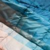 Close up of Patina Pixel eco-friendly camping blanket