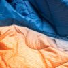 Close up of sustainable travel Rumpl blanket in Sunset Fade