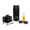 Rumpl black recycled travel blanket next to camera and sunglasses for sustainable travel
