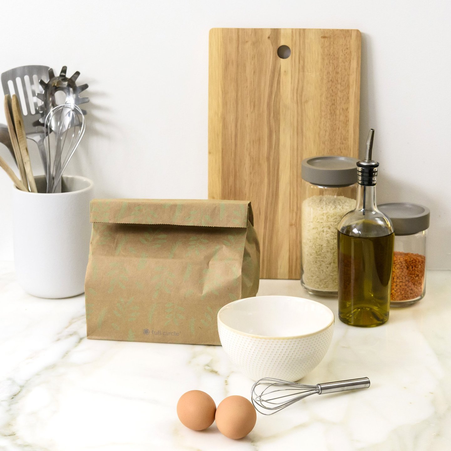 FULL-CIRCLE-COMPOST-BAG-10 Planet friendly 1.5 gallon home composting bag of recycled kraft paper on counter