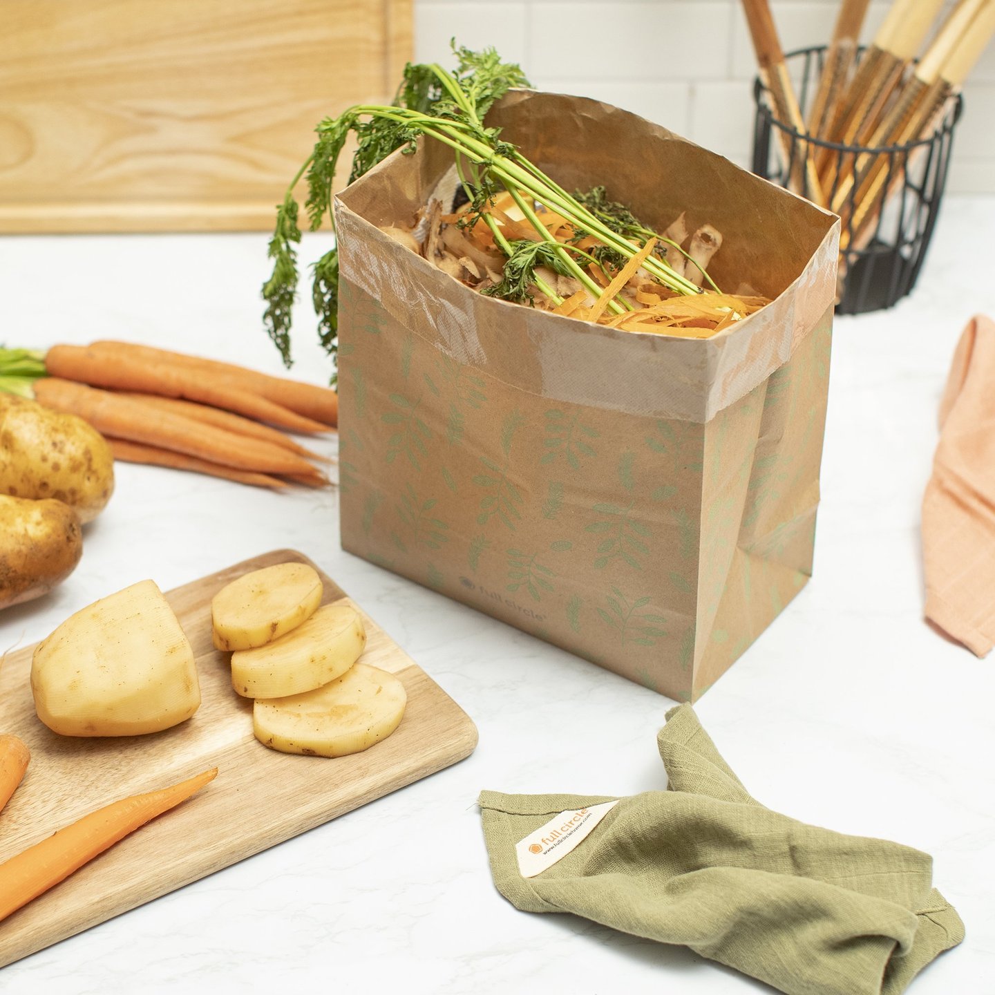 FULL-CIRCLE-COMPOST-BAG-6 Planet friendly 1.5 gallon home composting bag of recycled kraft paper on counter
