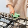 Green microfiber recycled cleaning cloth on stainless steel for low waste cleaning
