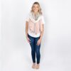 Model is shown wearing the Zestt Organics travel scarf in blush color block, made from 100% organic cotton.