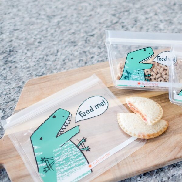 Reusable lunch bags in 2 sizes with Dinosaur 'feed me' print on cutting board