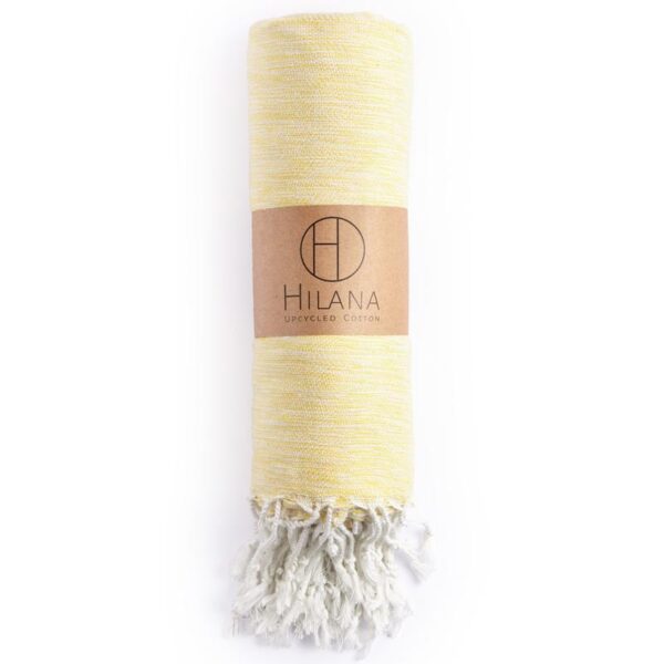 Hilana brand ultra-soft, eco friendly yellow Yalova blanket/throw is sustainably made with regenerated cotton.
