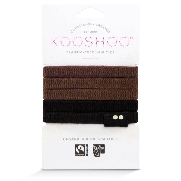 Photo shows brown and black dyed Kooshoo hair ties on FSC certified paper packaging, made from organic cotton and fair trade natural rubber.
