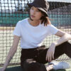 Female wearing black travel bucket hat from tentree