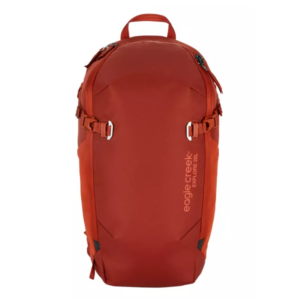 The Explore 26L backpack by Eagle Creek, made sustainably from recycled textile fabric, is shown here in midnight sun red, with external compression straps.