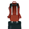The eco-friendly Explore 26L backpack by Eagle Creek has a trolley sleeve on the back panel which allows you to easily secure the pack on top of any dual-handled wheeled travel bag; shown here in midnight sun red.