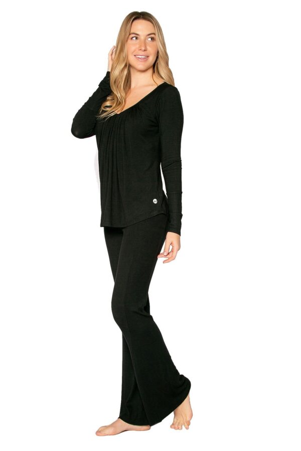 Model is wearing the eco-friendly black happy hour pants by JJWinks, with slimming side panel and a no muffin top four inch waist band.