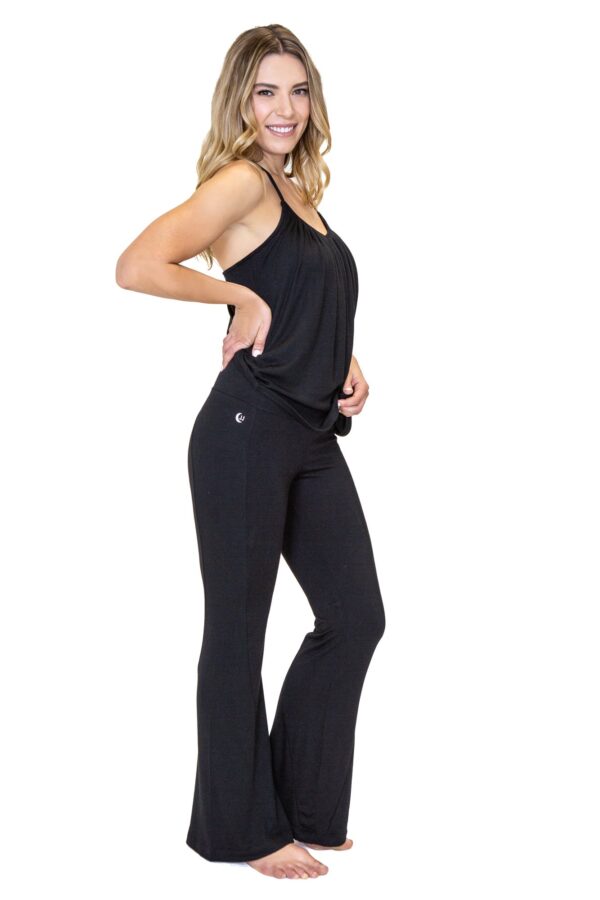 Model is wearing the eco-friendly black happy hour pants by JJWinks, with slimming side panel and a no muffin top four inch waist band.