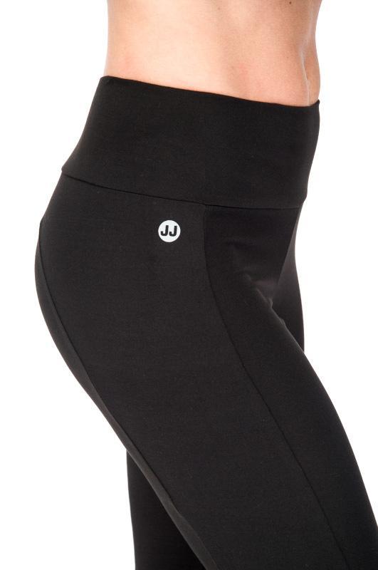 Model is wearing the eco-friendly black happy hour pants by JJWinks, with slimming side panel and a no muffin top four inch waist band.