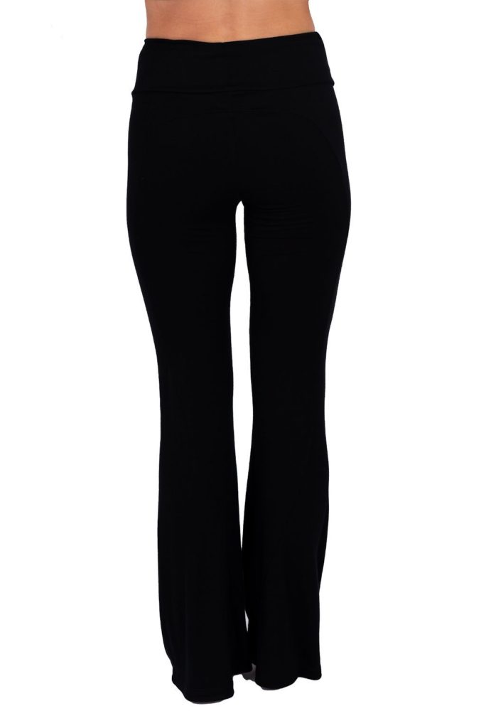 Model is wearing the eco-friendly black happy hour pants by JJWinks, with slimming side panel and a no muffin top four inch waist band.
