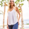 The JJWinks Slumber Party Top, shown here worn in white, is made from earth-friendly fabric in the USA and has a built-in bra shelf so you can be comfortable while out for happy hour!