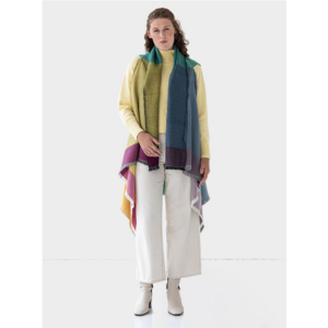 The Cape Infinity by Fifth Origins is made from organic wool and is sustainably made by women artisans. Shown here in color block rainbow.