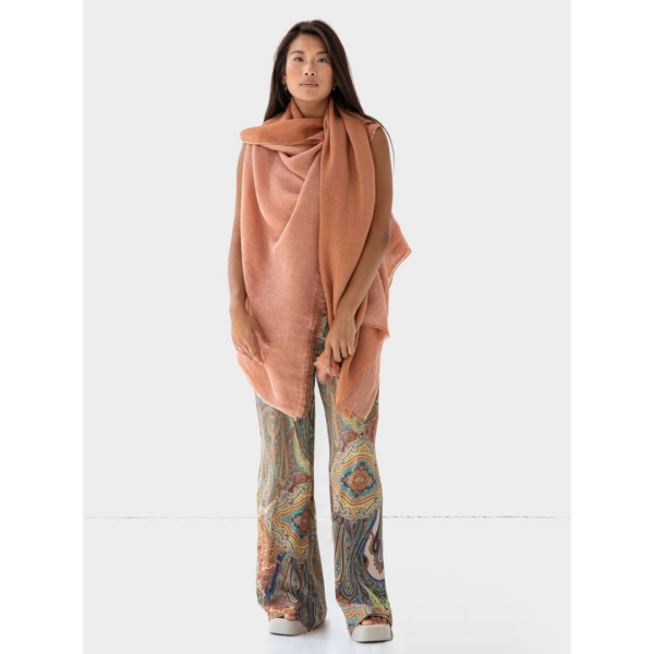 The Artisanal Cape Infinity Duo by Fifth Origins can be worn in over 20 ways, including as a full wrap or scarf. Made from organic linen, this cape is reversible and can be worn with either color linen facing outward.