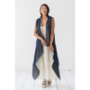This light and flowy cape is made from eco-friendly organic linen, and supports rural women artisans. Shown here in reversible blue and white.