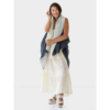 This light and flowy cape by Fifth Origins is made from eco-friendly organic linen, and supports rural women artisans. Shown here in reversible blue and white.