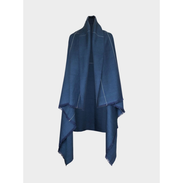 The earth-friendly Artisanal Cape Infinity Lite, shown here in peacock blue, is made from 100% organic Himalayan wool and is woven by women artisans.