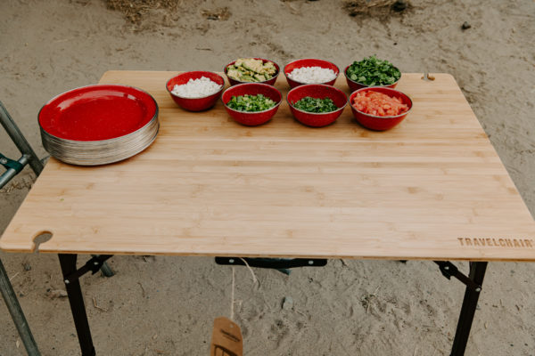 Food on eco-friendly bamboo and aluminum foldable travel table