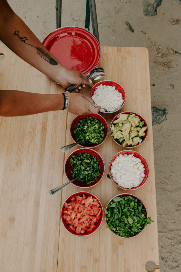 Overhead view of food on sustainable, folding bamboo and aluminum travel table