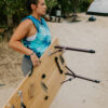 Woman carrying sustainable, bamboo and aluminum foldable travel table