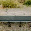 Outdoor view of unfolded travel cot for sustainable camping gear