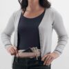 This money belt by Eagle Creek is made from natural silk. Photo shows model wearing money belt and opening zipper to access interior. An earth-friendly travel solution that will keep your belongings safe!