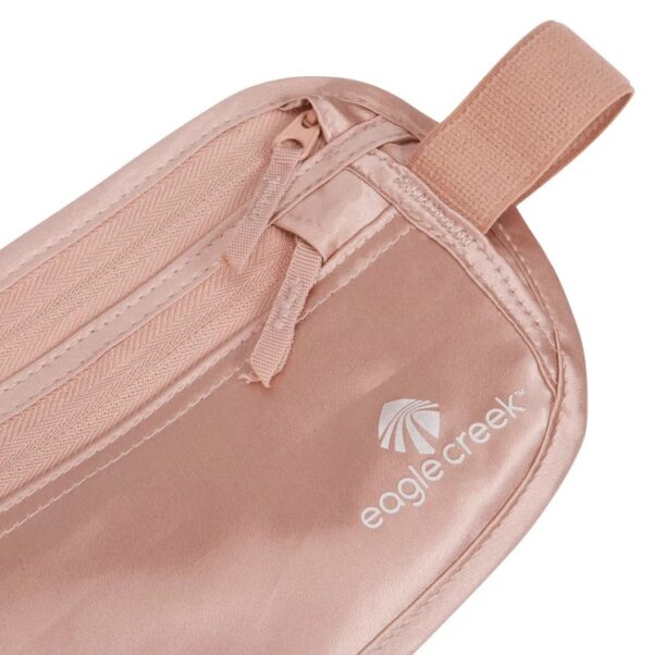 This money belt by Eagle Creek is made from natural silk. Photo shows close up detail of Eagle Creek logo and zipper pulls. A sustainable travel solution that will keep your belongings safe!