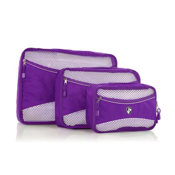 The earth-friendly 3 piece packing cube set, shown here in purple, is made by Heys Luggage using 100% recycled fabric made from landfill-bound plastic bottles. Displayed here in large, medium, and small.