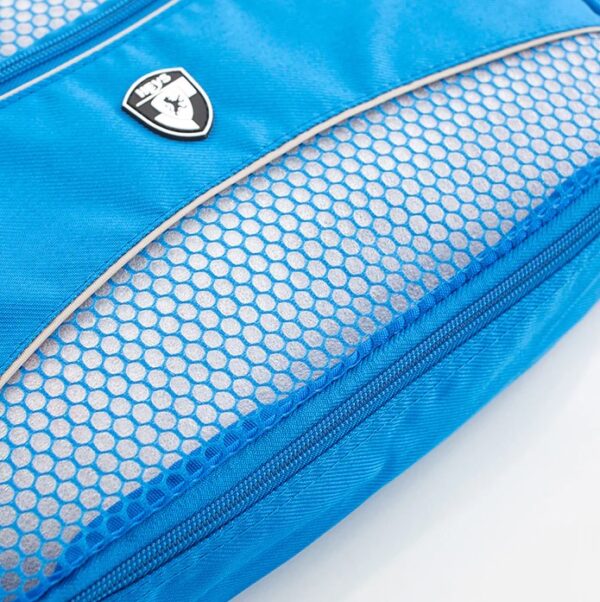 The eco-friendly packing cubes made by Heys Luggage are made from Ecotex, a fabric created from recycled water bottles. This cube, shown in blue, is viewed in the close-up to show its sturdy zipper and mesh front.