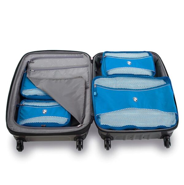 A piece of luggage packed with Heys Luggage packing cubes, shown here in blue. These cubes, made from recycled water bottles, are a great way to make packing easy and keep off of your clothes and accessories organized.