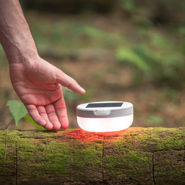 Explore solar powered light and speaker camping and hiking in the woods