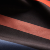 The Ultralight quick dry towel by Nomadix, shown here in close up in Pinstripes Multi, is made from post consumer recycled materials and has a micro suede texture.