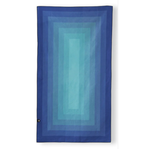 The Ultralight quick dry towel by Nomadix, shown here in Zone Teal, is made from post consumer recycled materials and is eco-friendly.