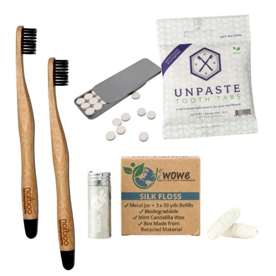 Plastic free dental care set with toothpaste tablets, bamboo toothbrushes and biodegradable dental floss