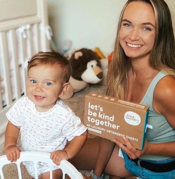 Woman and baby with plastic-free, natural laundry detergent sheets