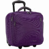 The Hybrid Rolling Tote by LiteGear, shown here in purple, has inline skate wheels and a locking telescoping handle, and is made from recycled materials.