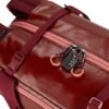 Close up of the migrate duffel bag by Eagle Creek, shown here in burnt berry, is a 40 liter duffel bag with dark red fabric and light red zippers and is made from 100% recycled materials.