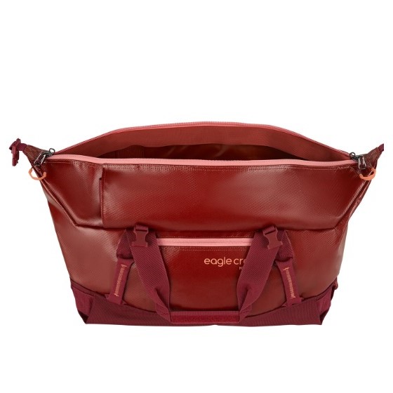 The migrate duffel bag by Eagle Creek, shown here in burnt berry, is a 40 liter duffel bag made with recycled materials.