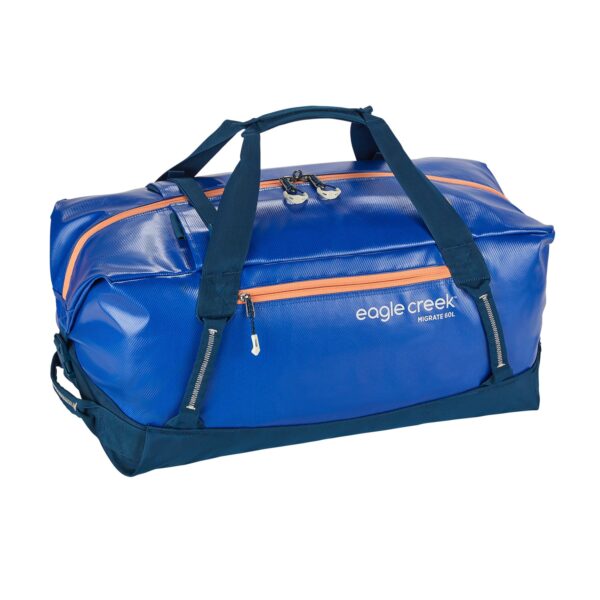The sustainable migrate duffel bag by Eagle Creek, shown here in mesa blue, is a 60 liter duffel bag with blue fabric, orange zippers, and navy straps that is made from durable and weather-resistant recycled materials.
