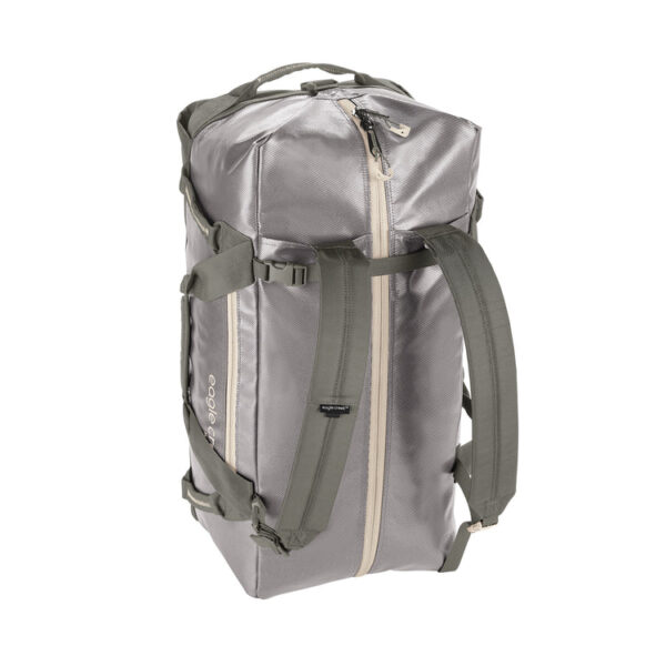 The sustainable migrate duffel bag by Eagle Creek, shown here in river rock silver, is a 90 liter duffel bag that is made from durable and weather-resistant recycled materials. It has versatile backpack straps that can be tucked away when not in use.
