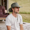 Man in olive UPF sun protection travel hat in olive