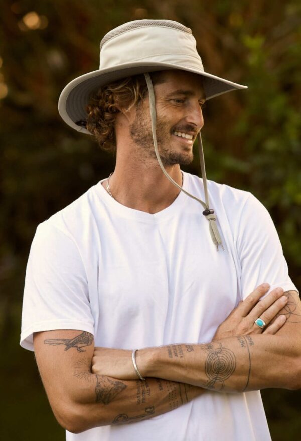 Side view of man in Tarpon recycled, floatable boating and travel hat